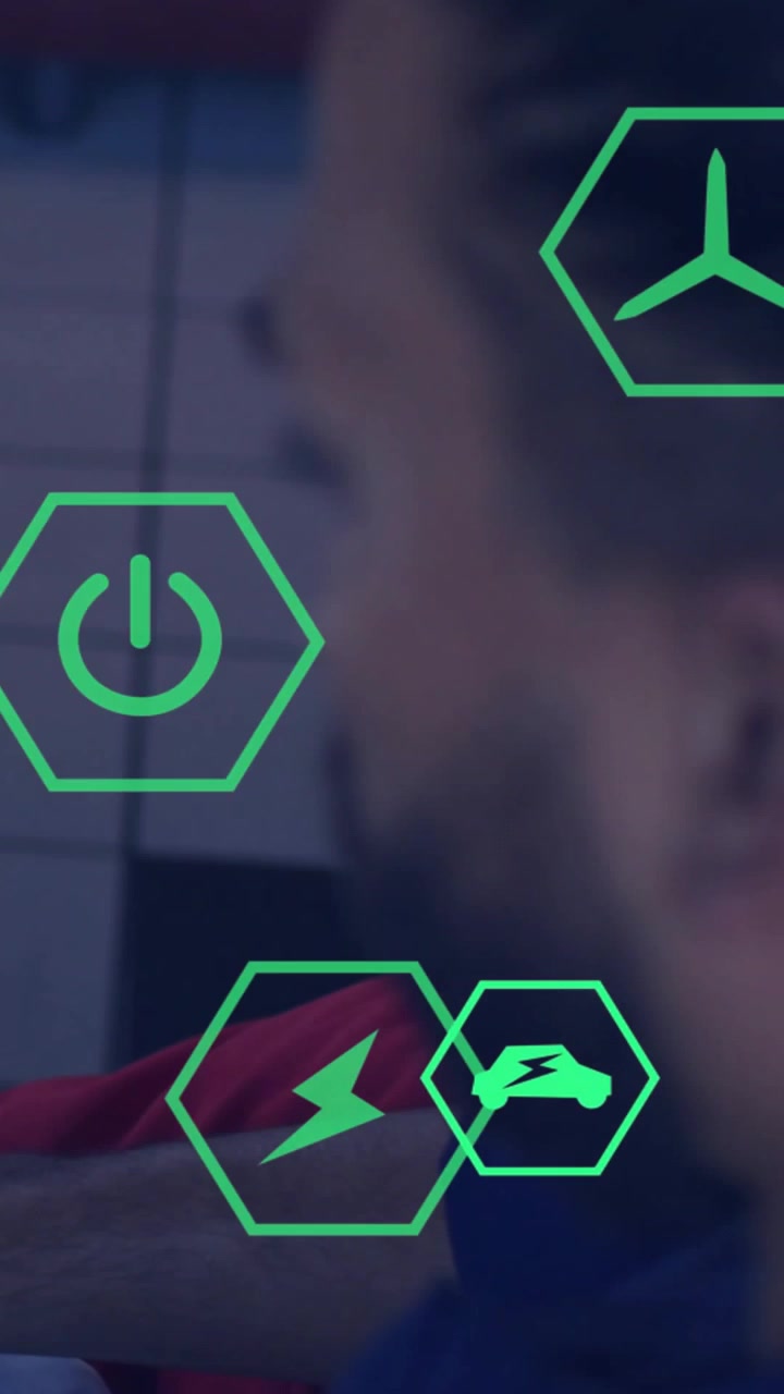 Vertical video: AR system overlaying neon hex icons while adult male adjusting focus for UX testing