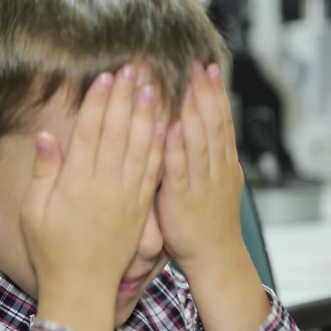 little boy checks eyesight in modern ophthalmological clinic. medical examination child.