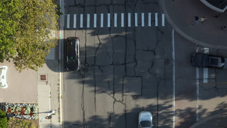 aerial top down drone view of a pedestrian crossing on the road