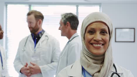 front view of middle-east female doctor standing with arms crossed in hospital