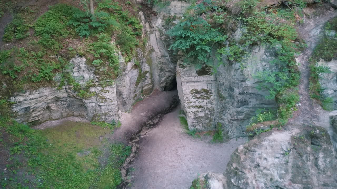 Devil's Oven or Large Ellite Natural Geological Monument  Located in the Gauja National Park at Lode Behind Cesis in Latvia. Licu – Langu Sandstone Cliffs Liepa Cave. Aerial Dron Shoot.