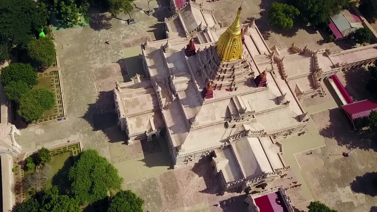 A stunning bird's-eye aerial view over the White Temple at Ananda Temple in Bagan, Myanmar, highlighting the golden Sertok. Perfect for showcasing the temple’s architecture and historical beauty.