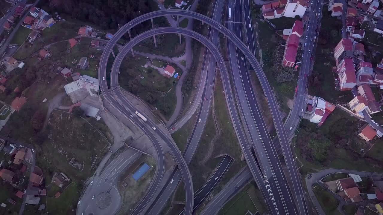 Aerial view of a precarious highway overpass at dark sunset in Spain