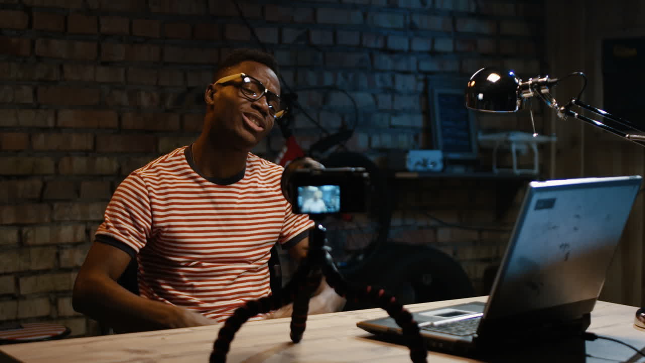 Man Vlogging from Home Studio