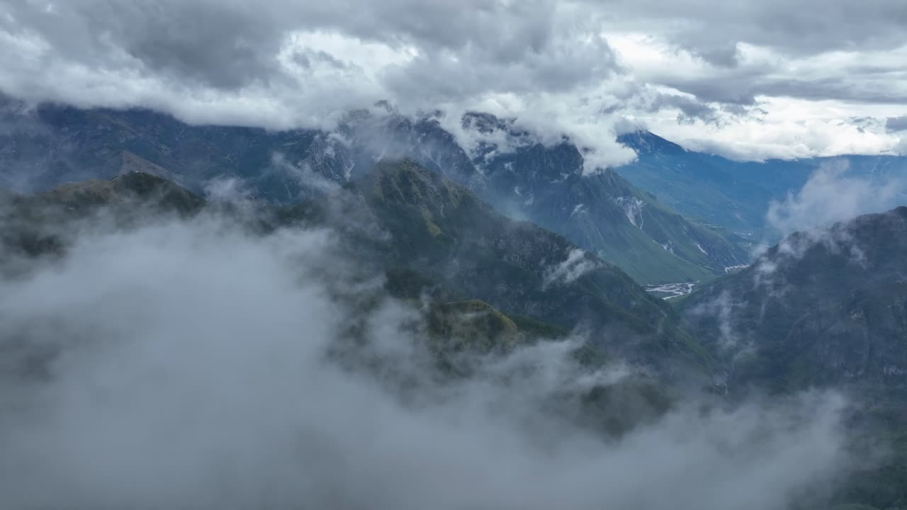 Amazing panoramic view of mountains among the clouds in Theth National Park, Albania.