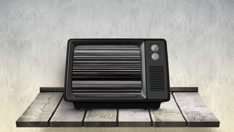 televisión en la parte superior de una mesa de madera