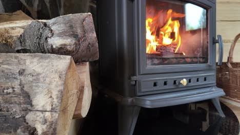 wood-heated mountain house - cozy fire burning in the fireplace - 4k