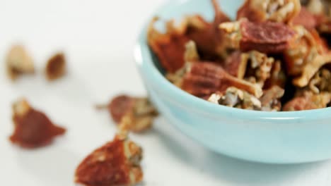 dried chilies in bowl placed on white surface 4k 4k