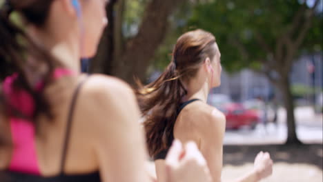 Two-running-women-Fitness-athletic-friends-jogging-in-the-urban-city