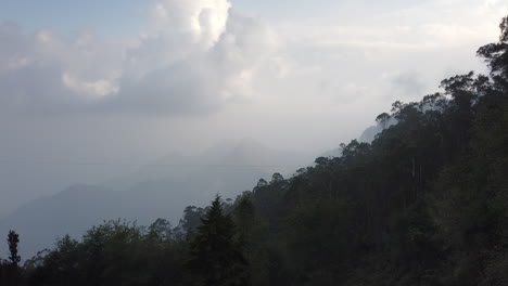 Cumulus-cloud-timelapse-forming-in-the-forested-mountains-above-Kodaikanal,-Tamil-Nadu,-India