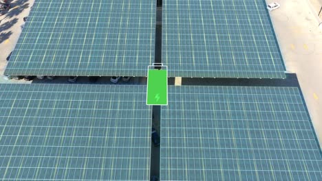 VFX-motion-graphics-overlay-of-large-solar-panels-on-top-of-parking-structure,-energy,-sustainable-concept,-aerial-rising-view