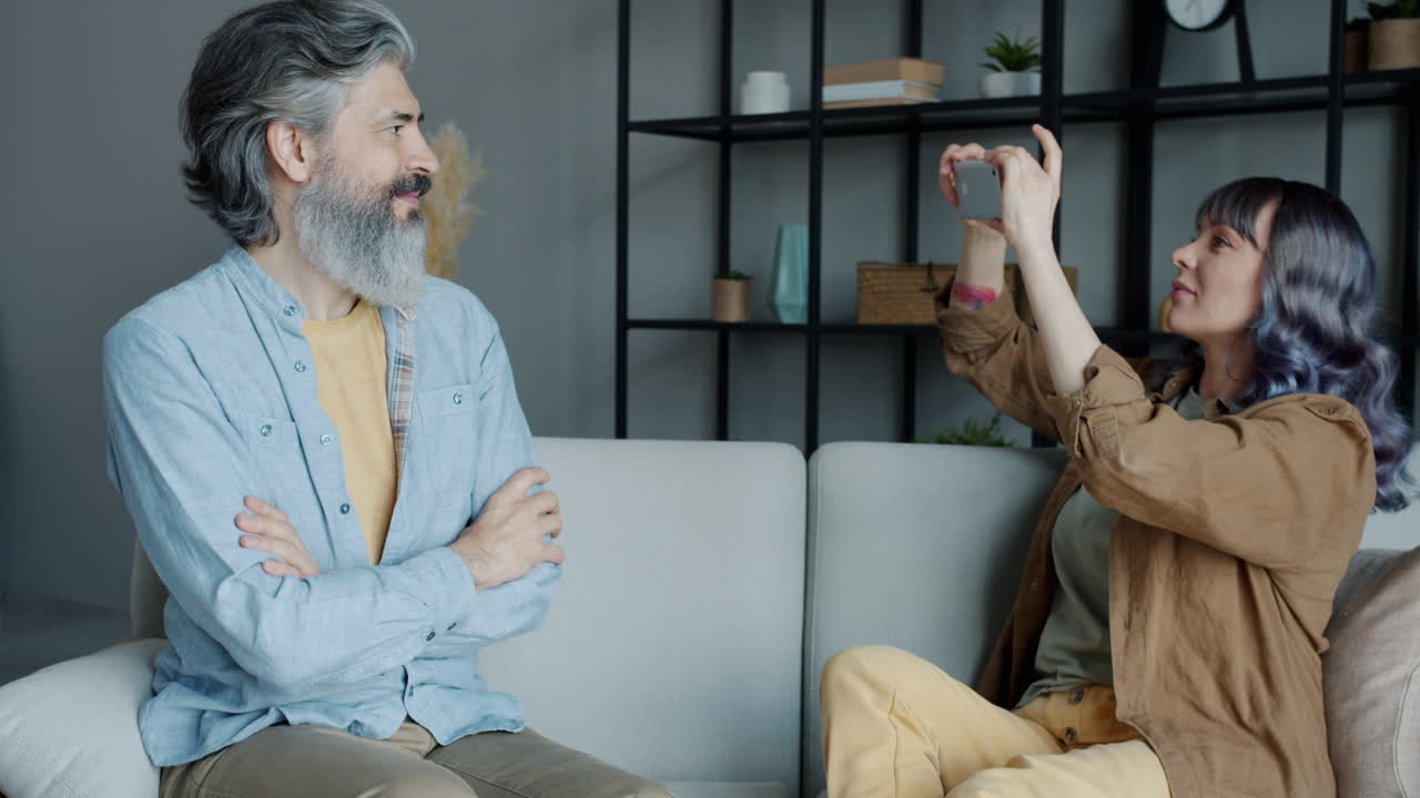 Couple interacting on sofa