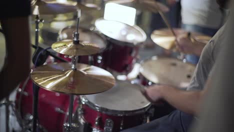 a woman playing on drum in the theatre static shot, close up shot, insert shot