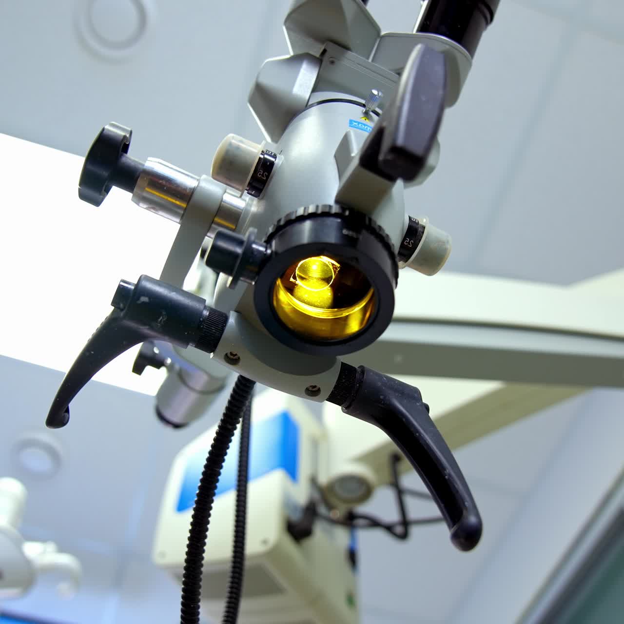 Scientific laboratory microscope. Contemporary microscope in the laboratory on the ceiling background. Close-up. Education, science or medicine industry