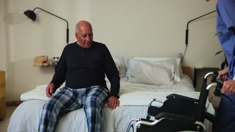elderly man being helped by a caretaker