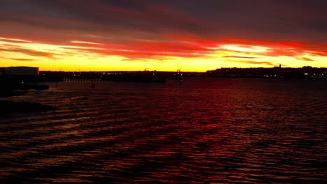 fiery scenic sunrise red skyline reflection in portland maine bay harbor waterfront