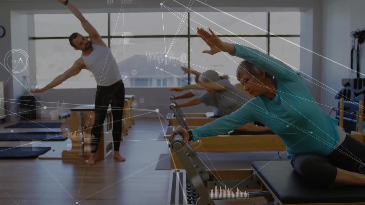 Pilates instructor demonstrating side bend, students mirroring sliding reformers for core alignment