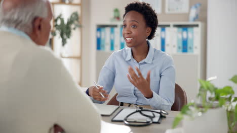 doctor consulting with senior patient in office