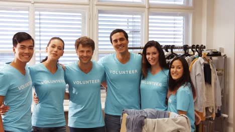 Happy-volunteers-gathering-clothes