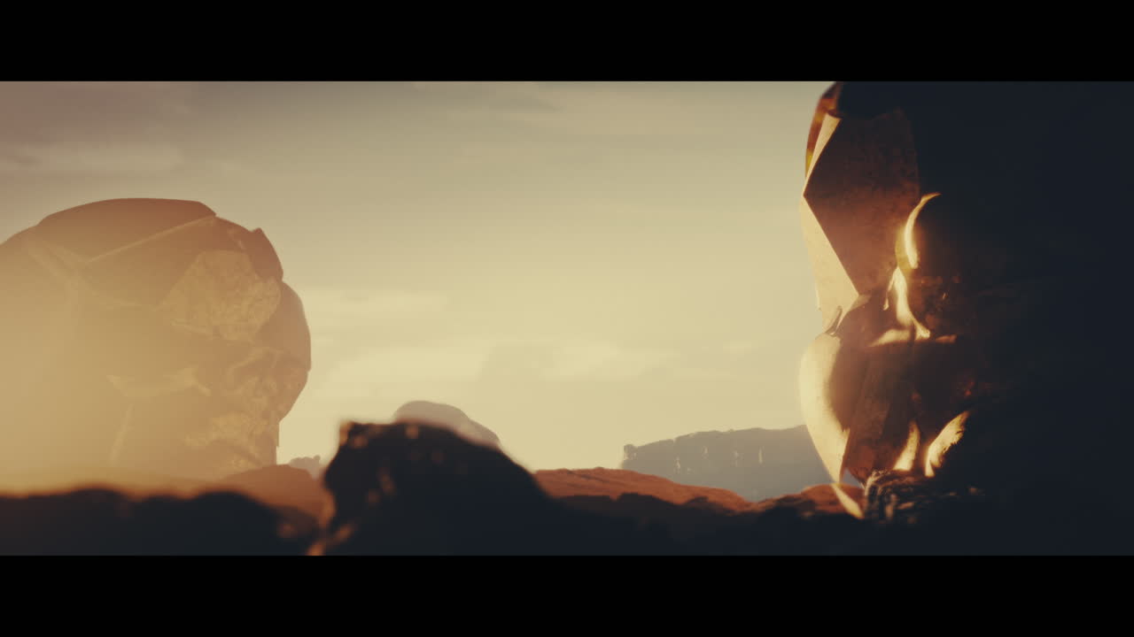 Huge golden statues in the desert during sunset