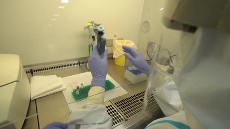 nurses in ppe suits working together on developing plasma in the laboratory