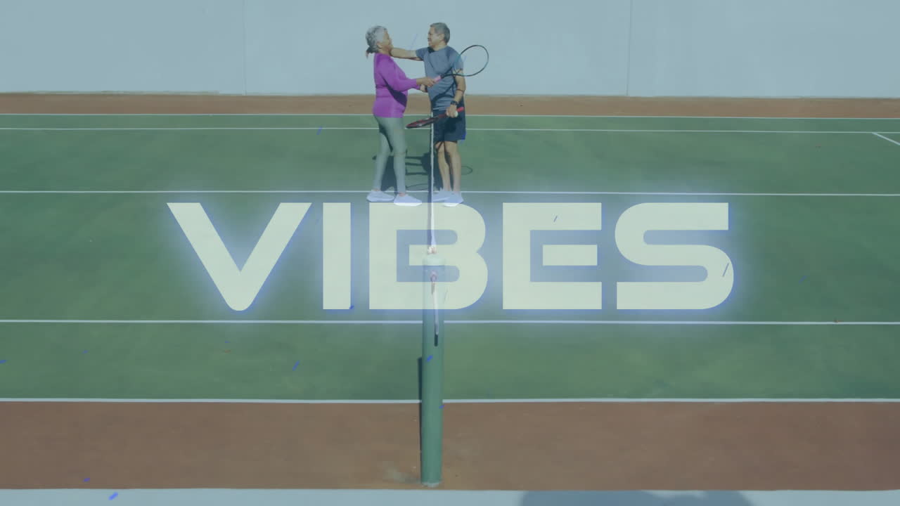Senior couple practicing tennis on sports court, featuring animated VIBES text and ball hopper