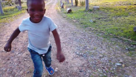 black boy running up the driveway