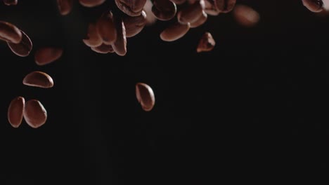 coffee beans fall through shot slow motion