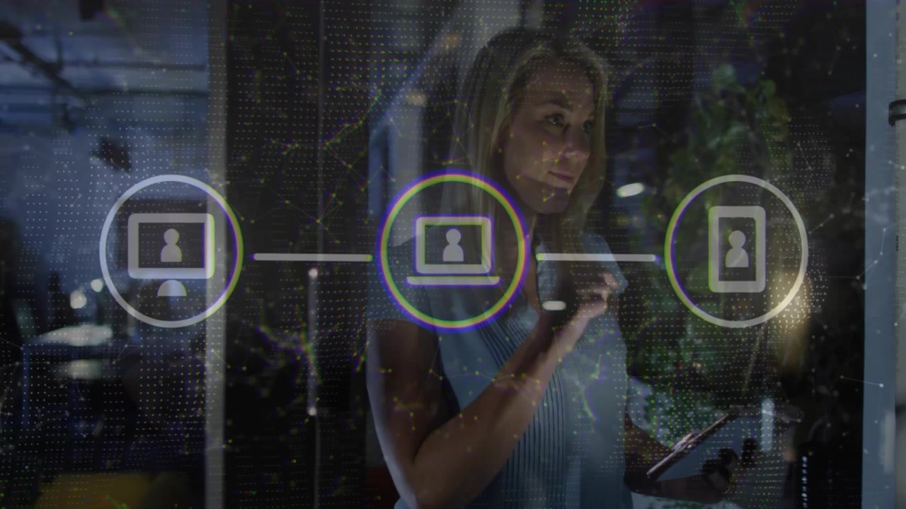 Business woman tapping tablet, initiating network icons connecting three user nodes in office