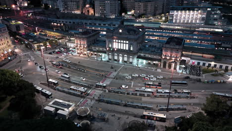 night drone arc view of traffic on street in front of brignole railway station