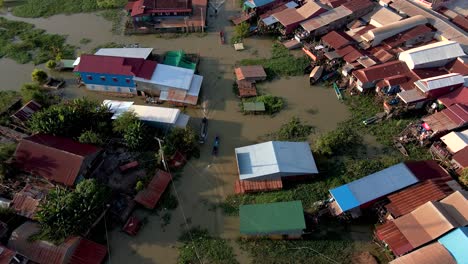 Floating-village-of-stilt-homes-and-boat-traffic