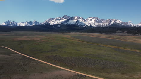 pan down and dollly shot of the majestic sawtooth mountains in idaho