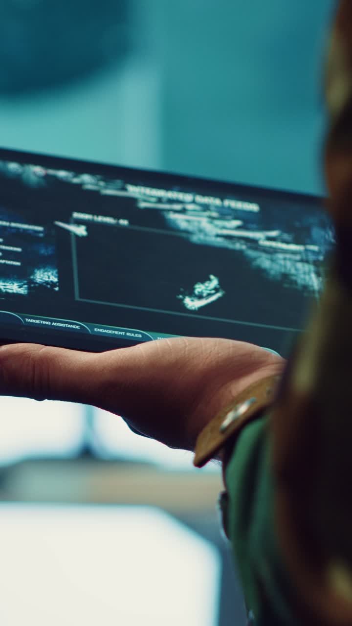 Military Person's Hand Interacting with Tactical Digital Tablet