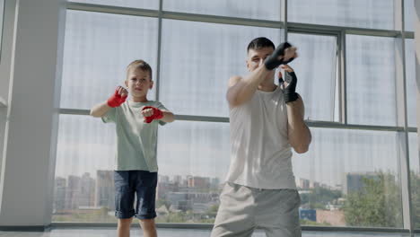 father and son boxing training