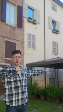 man pointing outdoors in an italian town