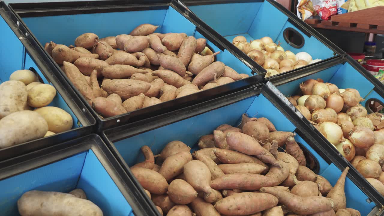 Closeup shot of woman putting labeling on produce at food shelf in asupermarket in Minnesota, USA.