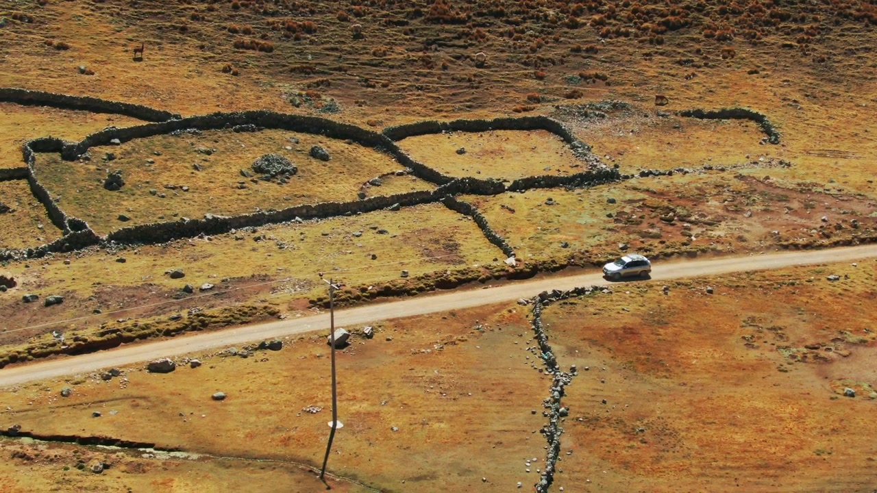 Vehicle traveling around the Inca ruins of Chaullacocha, Cusco. Aerial