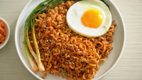 homemade dried korean spicy instant noodles with fried egg