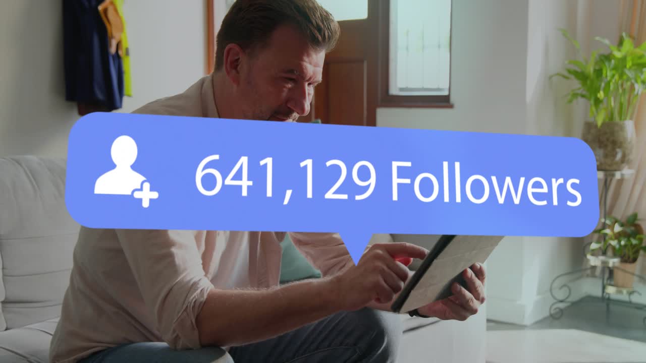 Mature man tapping tablet as blue follower bubble appearing, growing, tracking social media growth
