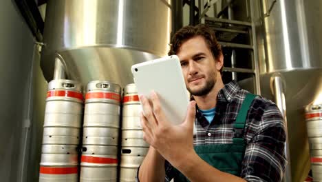 brewer using digital tablet in brewery factory 4k