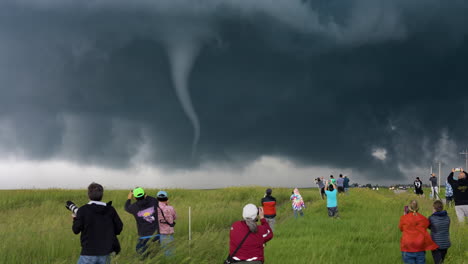 spectacular tornado touches down as storm chasers look on and film