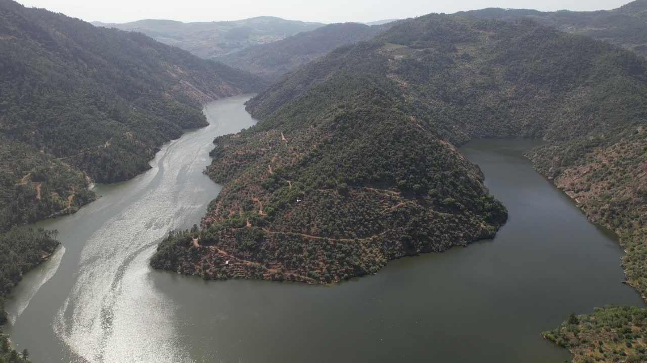 Aerial view of Tua River winding between forested hills