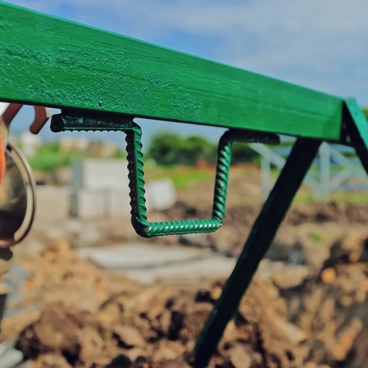 Construction industry. Building equipment on the ground. Engineering works. Builder puts building tool. Close-up.