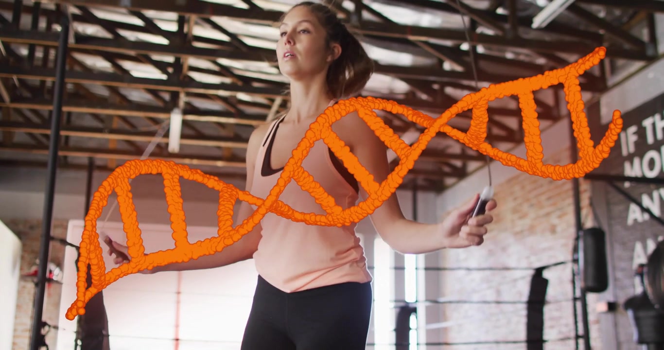 Professionista del fitness che salta la corda sul ring di pugilato, con un'animazione di un'elica di DNA che si frammenta e si riforma.