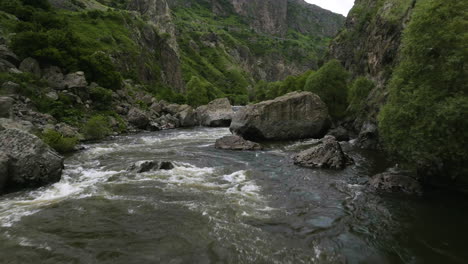 fast flowing kura river in deep gorge at the foot of the tmogvi castle mount in samtskhe-javakheti region, georgia