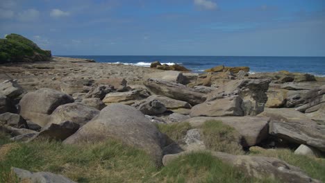 blue sky over the rocky coast and ocean - empty beach in eastern suburbs - sydney, nsw, australia