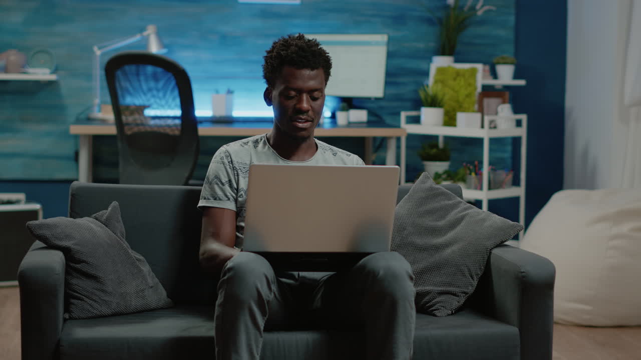 Entrepreneur holding laptop and working from home