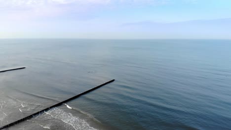 aerial shot of sandy beach in ustka in winter