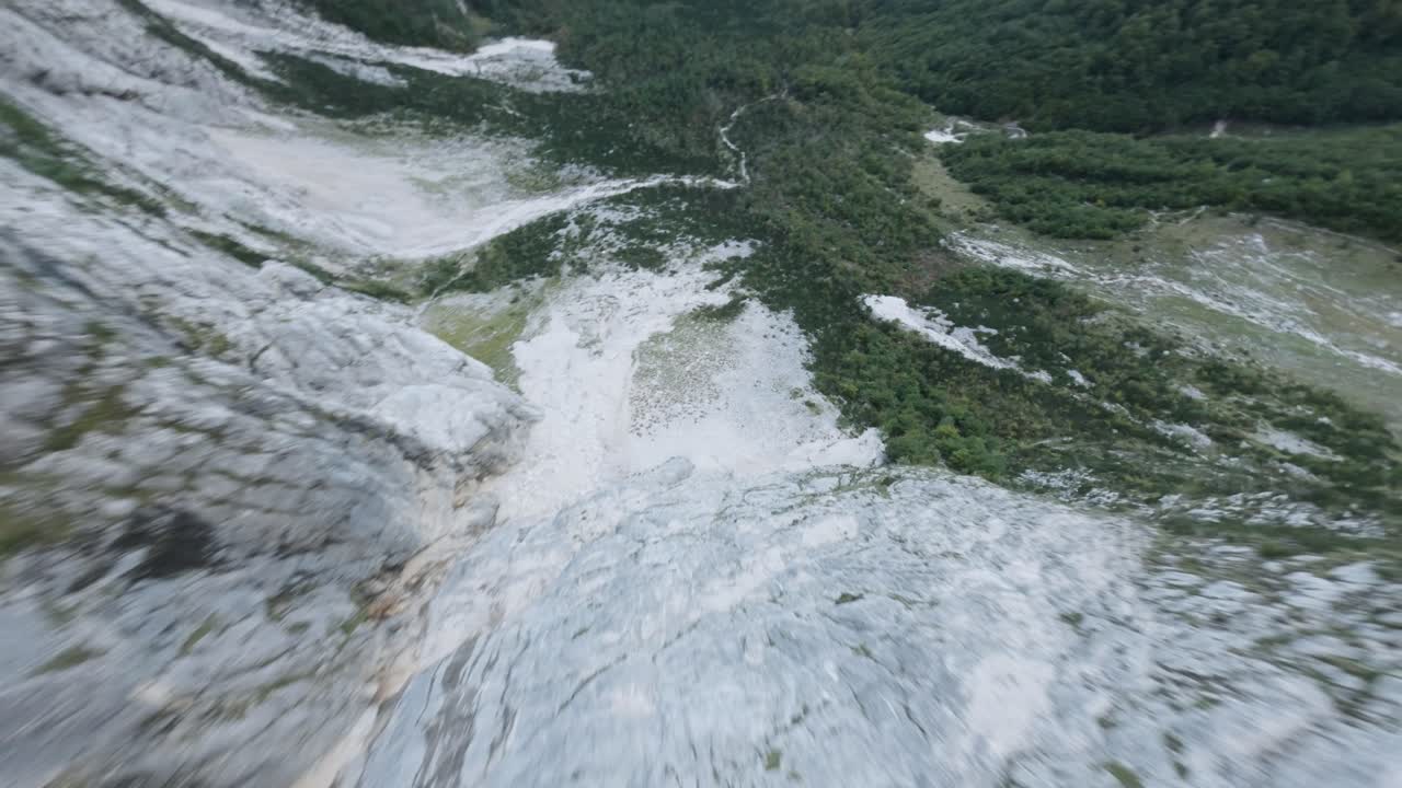 FPV drone dives down a seam mountain in Triglav National Park in SLovenia