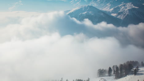 Low-lying-valley-fog-in-a-rugged-winter-mountain-landscape---time-lapse